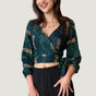 Woman wearing navy hand-dyed batik Brush Strokes print long sleeve wrap top by GEOMETRIC. 